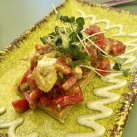 Faina (GF chickpea bread) with avo and tomato + some mayo  at Astrid in Malaga
