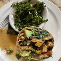 Veggie wrap + tempeh w kale slaw (I ate the other half of the wrap already before this photo 😋)  at The Elusive Cow in Bellevue