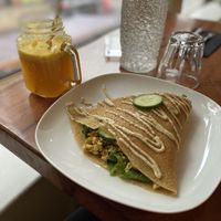 Breakfast crepe and pineapple/turmeric juice  at Little ChoC Apothecary in Brooklyn