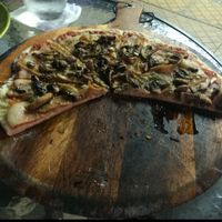 Vegan pizza with mushrooms, veg meat, and veg cheese.  at Oliva Pizzeria in Santiago