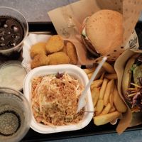 First order - vegan nuggets, coleslaw, cherry cola, elderflower, cheese burger, schnitzel burger and mayo dipping sauce at Swing Kitchen - Schottenfeldgasse in Vienna