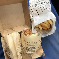 Hot root wrap and fries for „to go" at Swing Kitchen - Schottenfeldgasse in Vienna