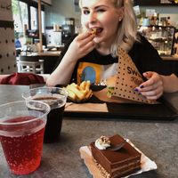 My sister enjoying Vienna burger at Swing Kitchen - Schottenfeldgasse in Vienna