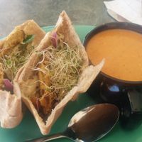 Falafel sandwich with a side of tomato basil soup at Field of Greens in Houston