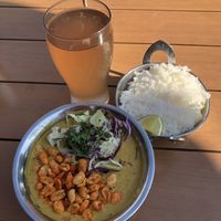 Peanut Tomato Curry with Lavender Kombucha  at Spork in Bend
