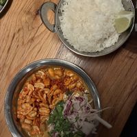 Peanut tomato curry with rice  at Spork in Bend