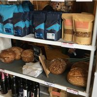Fresh bread with labeled vegan choices at River Rock Coffee in St Peter