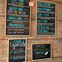 Menu board with clearly labeled vegan items such as smoothie bowls, granola bowls and soups. at River Rock Coffee in St Peter
