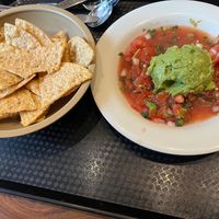 Guac plate with bottomless chips at Aqui in Campbell