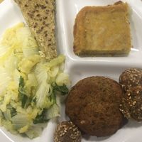 Lentil meatballs and croquettes, daikon tart, broccoli and tofu tart, Chinese cabbage at Sinergy in Vigevano