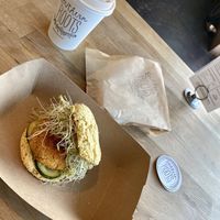 Roots Biscuit
Sweet Potato-Quinoa Patty with pickles, smokey seed spread, and sprouts at Southern Roots Filling Station in Jacksonville