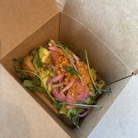 Loaded Avocado Toast
Smashed avocado, pickled onions, spiced walnuts, cilantro oil, and Kravey Garden Pea Shoots
*** with gluten-free bread at Southern Roots Filling Station in Jacksonville