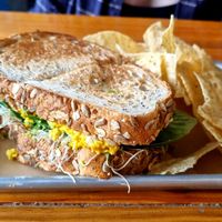 Tofu-Egg Salad Sandwich (served with corn chips) at Southern Roots Filling Station in Jacksonville