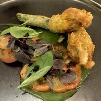 Zucchini flowers!  Crumbed zucchini flowers filled with cashew ‘cheese’ | Victorian heirloom tomatoes | dried black olives green gazpacho dressing at Matteo's in Fitzroy North