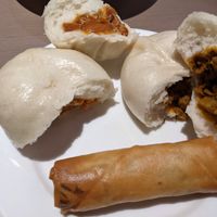Bbq buns, curry buns, spring rolls (this is half of each) at Zen Gardens in London