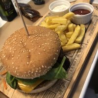 Fresh made quinoa burger, chips with aioli and ketchup at Punto Vegano in Madrid