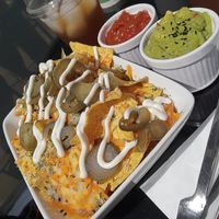 Cheese Supreme Nachos with guacamole and salsa at Vegan Antics in Gravesend