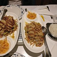 left: vegan delicious "duck" with fresh veggies and right: vegan delicious crispy chicken with fresh veggies at Asia Paradies in Vienna