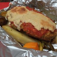 Lentil Meatloaf with cashew cheese and various potatoes backed in foil at Shakti en Chile in Santiago