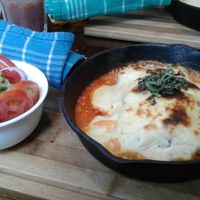 Menu; lasagna and salad at Shakti en Chile in Santiago
