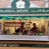 Friendly staff at the food stall. at Hummus House UK in Coventry