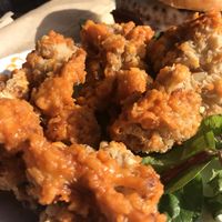 Buffalo cauliflower bites!  Oh my gosh!, They’re the best I’ve ever had and I’ve tried making these for years.  at Dory Deli in Newport Beach