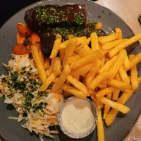 fries, cabbage salad and delicious vegan meat with gravy sauce at Lokal Vegan Bistro in Warsaw