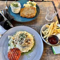 vegan carbonara and cutlet with potatoes + cucumber saladd  at Lokal Vegan Bistro in Warsaw