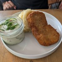 Soy cutlet with mashed potatoes and creamy cucumber and radish at Lokal Vegan Bistro in Warsaw