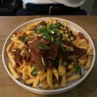 American style loaded cheesy fries with Seitan  at Lokal Vegan Bistro in Warsaw