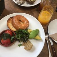 Bagel with tomato, avocado and hummus. Peanut cake.  at Scarecrow in Auckland