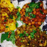 Mmmm chickpeas and rice come with your choice of 2 sides- all vegan. Yum! at Indigo in Washington