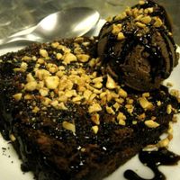 Chocolate cake with ice cream. The ice cream is delicious, but the cake could be improved upon. Anyhow, chances are you won't find many vegan cakes in Brazil, so order it anyway! =) at Vegetariano Social Clube Delivery in Rio De Janeiro