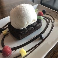 Decadent “Brownie with coconut ice cream”. That’s so rich, thick and sweet: perfect for desert lovers!  at H.O.P.E. in Studio City