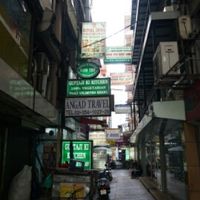 Under the green sign is the entrance at Guptaji Ki Kitchen in Bangkok