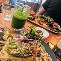 The avocado and vegan feta on sourdough. Really really good! (Vegan big breakfast in the background) at Waratah Organics in Upper Ferntree Gully