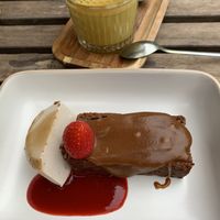 Sticky toffee cake with pecan ice cream, and a turmeric latte  at Bindicafe in Amersfoort