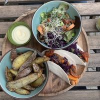 Wraps met filled with sweet potatoes, served with fried potatoes and salad  at Bindicafe in Amersfoort