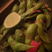 Edamame cooked with coconut oil instead of butter (listed on menu)  at Kismet Bar & Kitchen  in Ubud