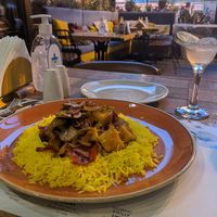 Mushroom, pepper and fresh pineapple stir-fry on yellow rice at Amigos in Skopje