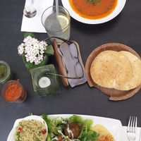 Hummus platted with tomato soup at Nanoosh in Berlin