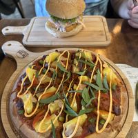 Satay pineapple pizza and Fishless burger that my uncle ordered and ate all of  at nomVnom Bistro - Clarke Quay in Central Singapore