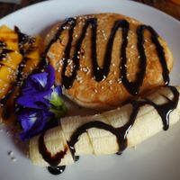 Pancake with banana and mango. at La Carotte Qui Rit in Koh Tao