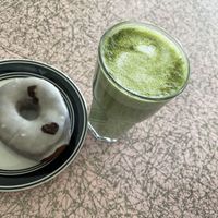 Matcha oat milk latte with a level 5 vanilla donut    at Mother Fool's Coffeehouse in Madison