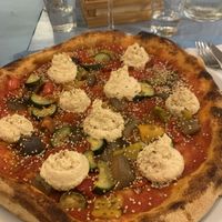Pizza with vegan philadelphia made out of chickpeas  at Pizzeria Capri in Jesolo