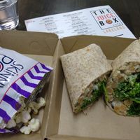 Bean Simmons chickpea "tuna" salad wrap with kale and spinach. Comes with popcorn or chips. at The Juice Box in Lakeland