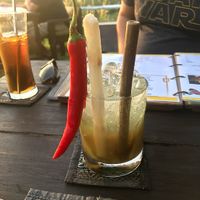 Galangal cocktail. This takes a long time to make because it is made from scratch, so be patient on this one, it's certainly worth it. Bamboo straw, chili & sugar cane (not spicy). at Rice Paddy in Koh Yao Noi