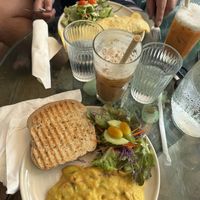 Boyfriend and vegetarian pesto wrap and I had vegan chickpea “stirfry” with iced Thai tea. Make sure to ask for sweet if you want sugar in it!  at Chaba Cafe and Gallery in Koh Yao Noi