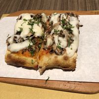 Vegan mozzarella on mushroom pizza at Pizza Pala Romana in Bangkok