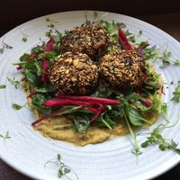 Cauliflower fritters with pumpkin hommus at Urban Projuice in Albert Park